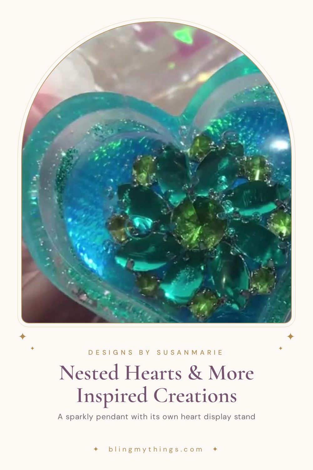 Close-up of a turquoise resin heart pendant set with green faceted jewels, titled Nested Hearts & More Inspired Creations